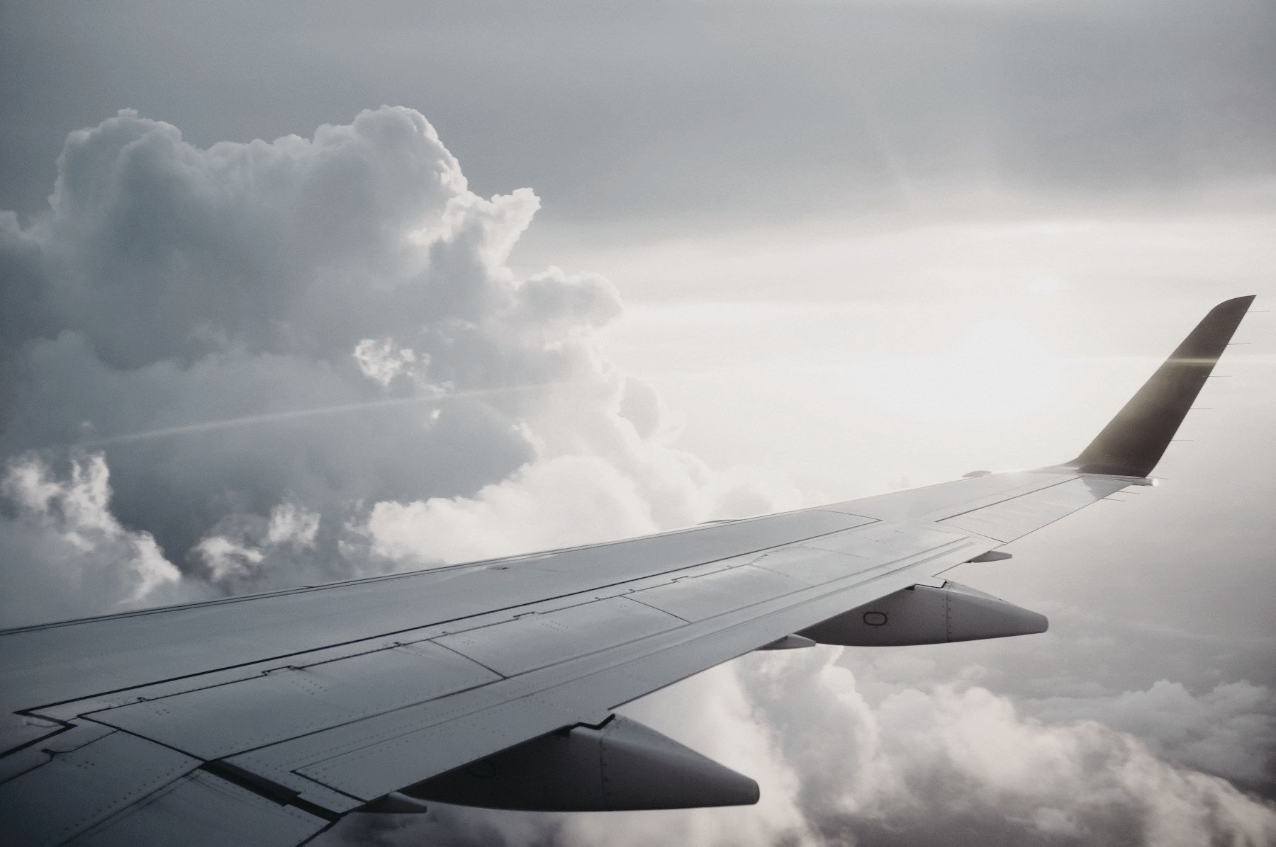 View of a plane wing above the clouds
